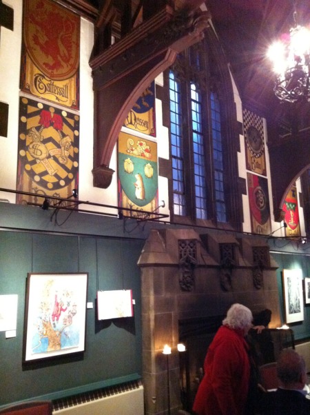 From the Arts and Letters Club great hall: the massive hearth, gothic window and fanciful coats of arms representing the founders of the club.